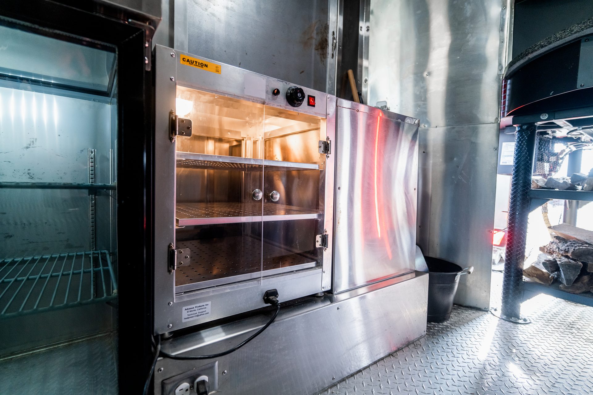 Warming cabinet and refrigerator inside the truck