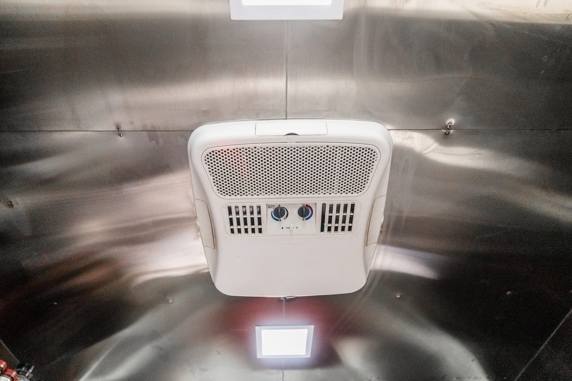 AC unit mounted on the ceiling of the food truck