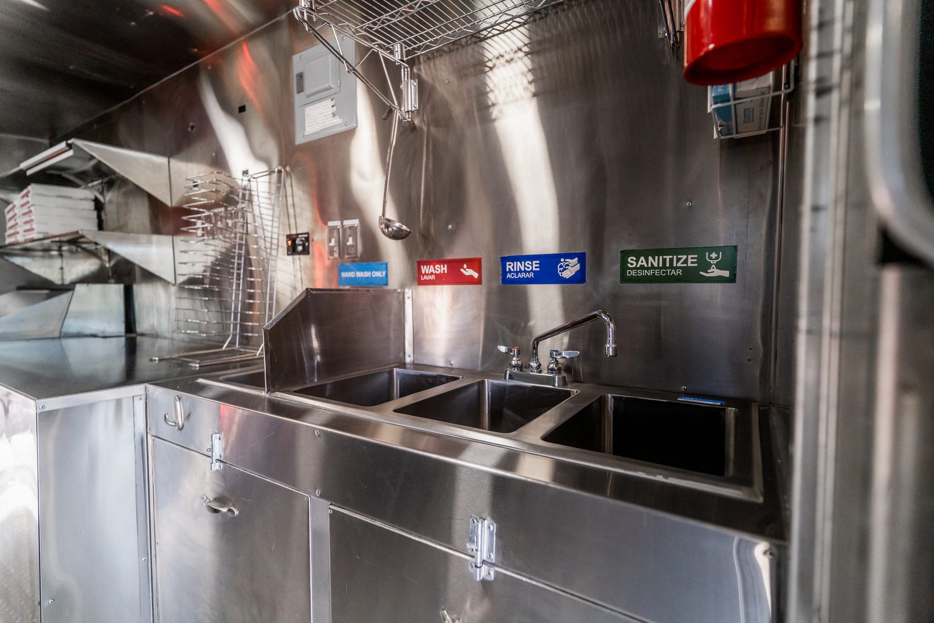 Stainless steel workspace with three-compartment sink