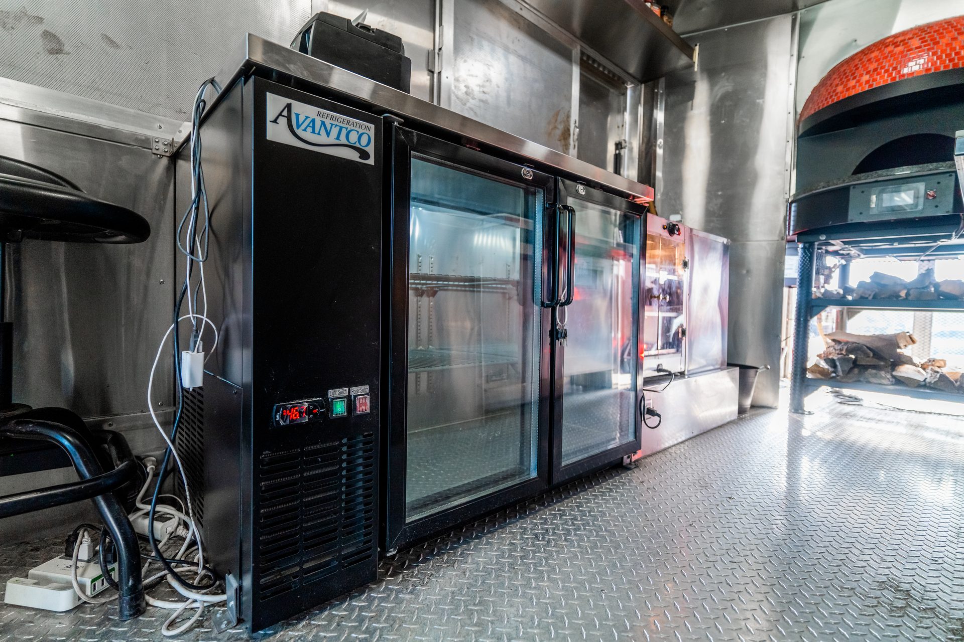 Interior view with refrigerator and brick oven