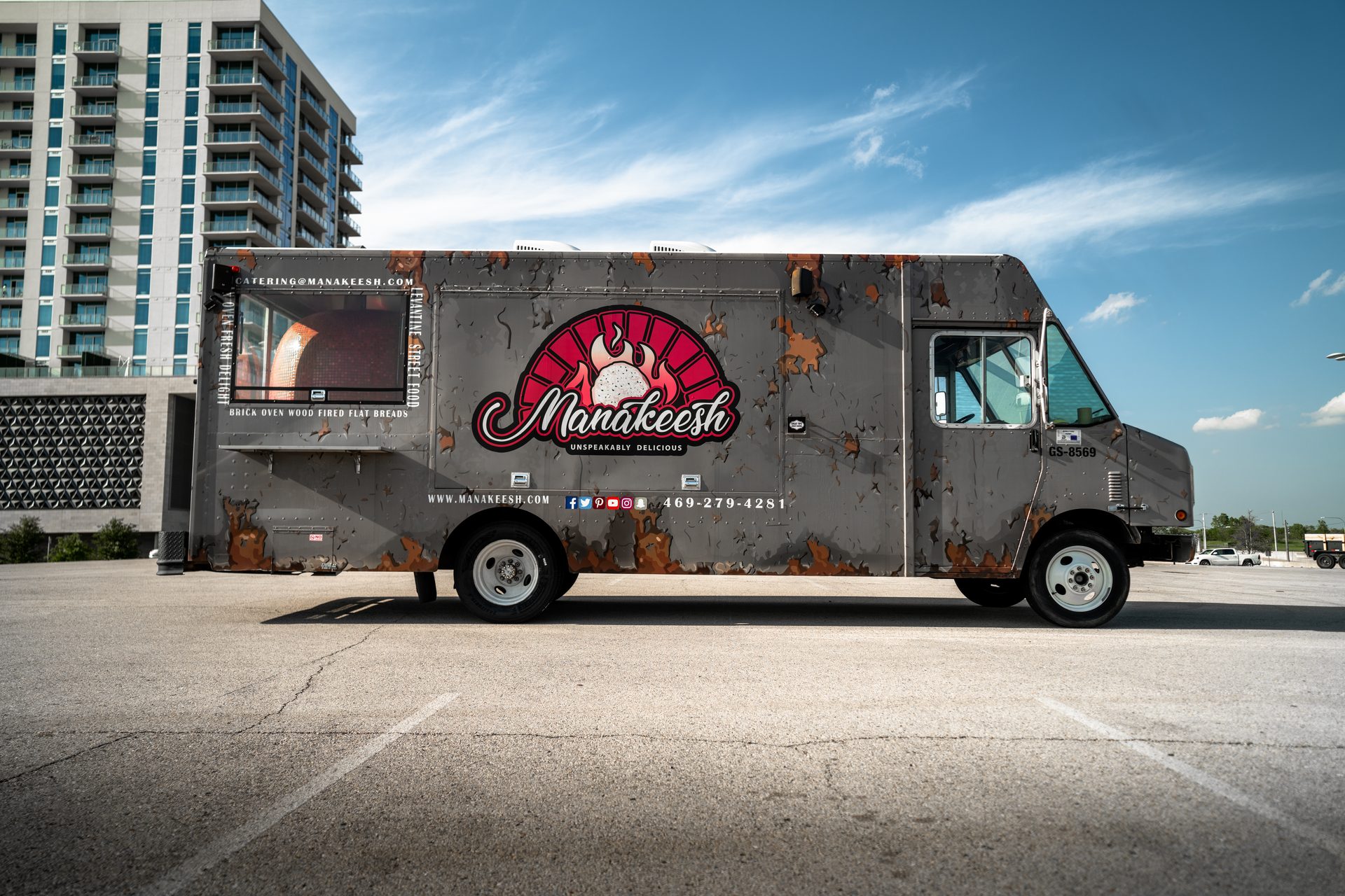 Manakeesh food truck full exterior with brick oven visible through window