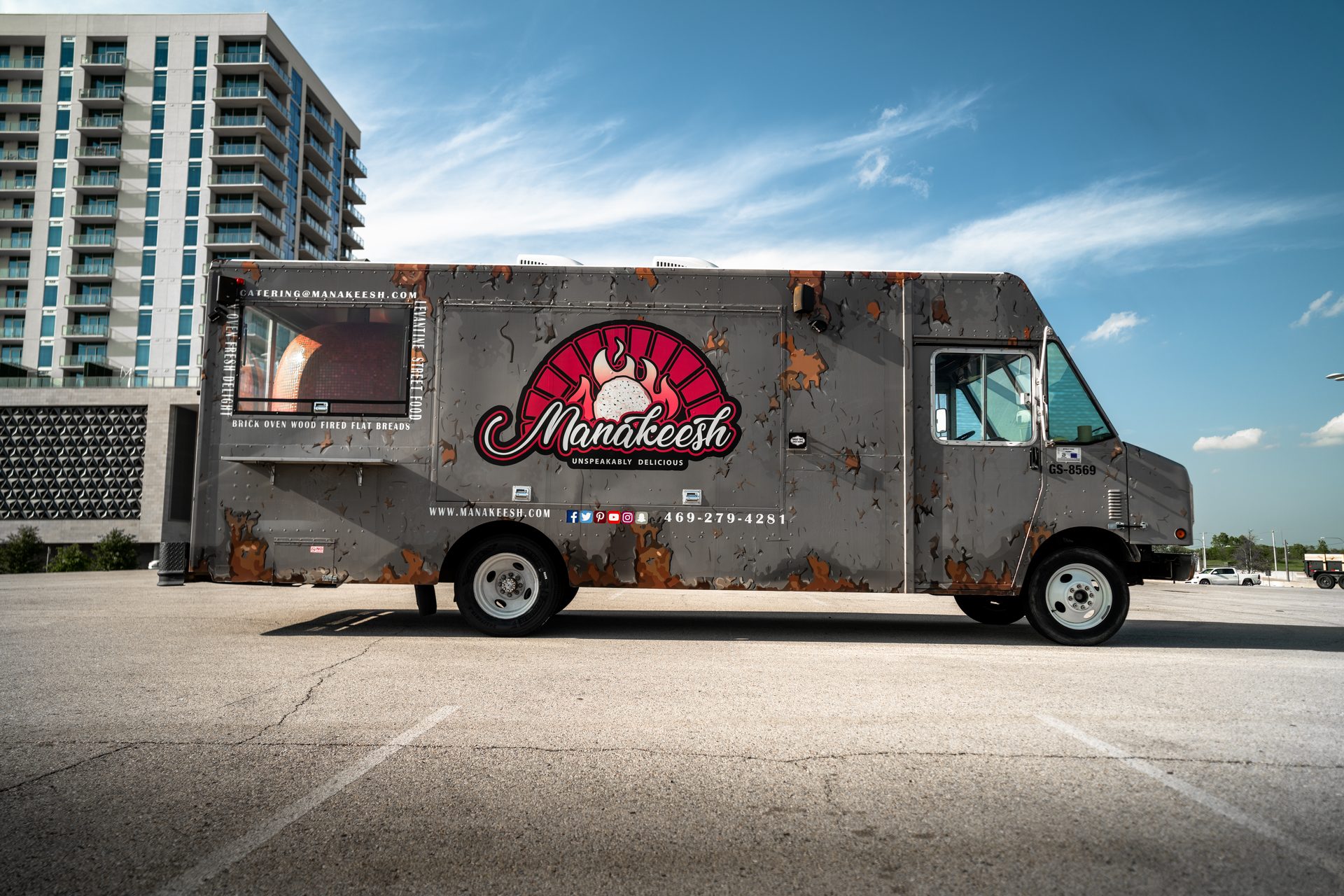 Full exterior view of the Manakeesh food truck with branding