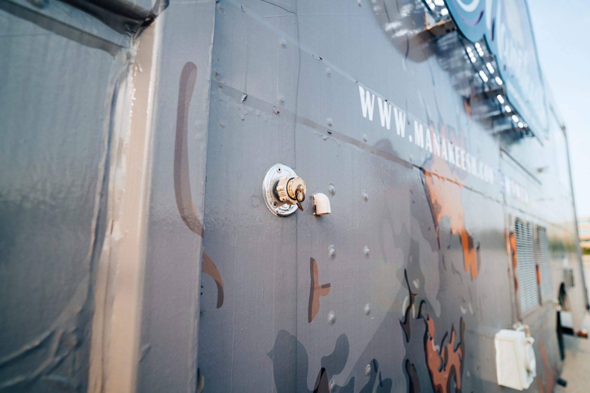 Close-up of exterior valve and website URL