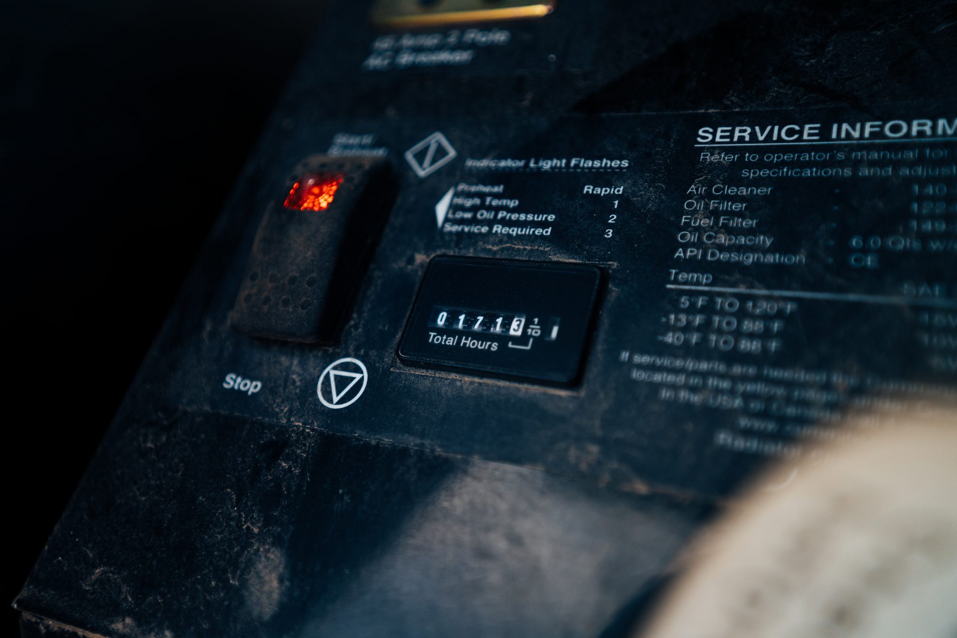 Generator control panel showing total hours and service info