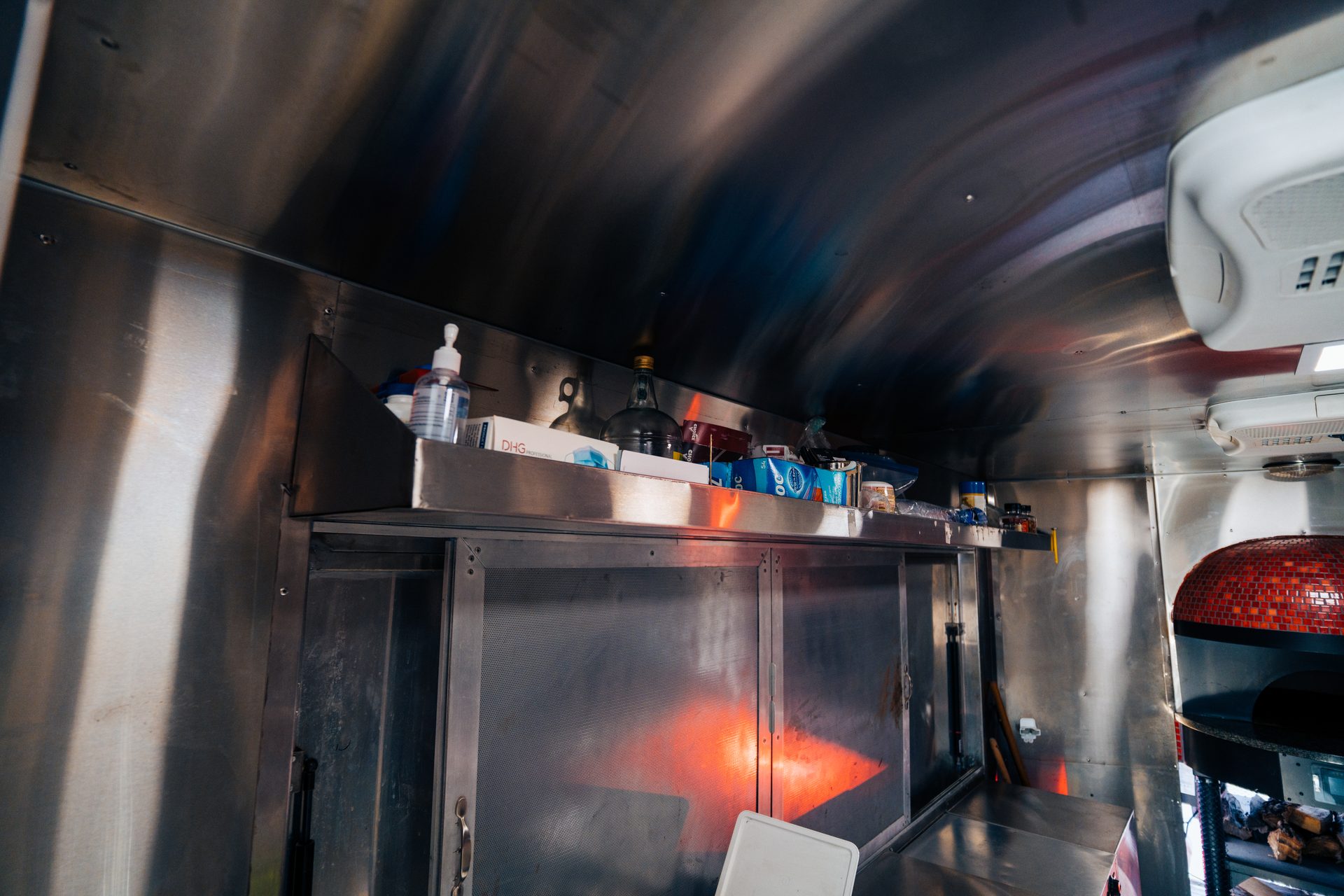 Stainless surfaces with shelf and brick oven