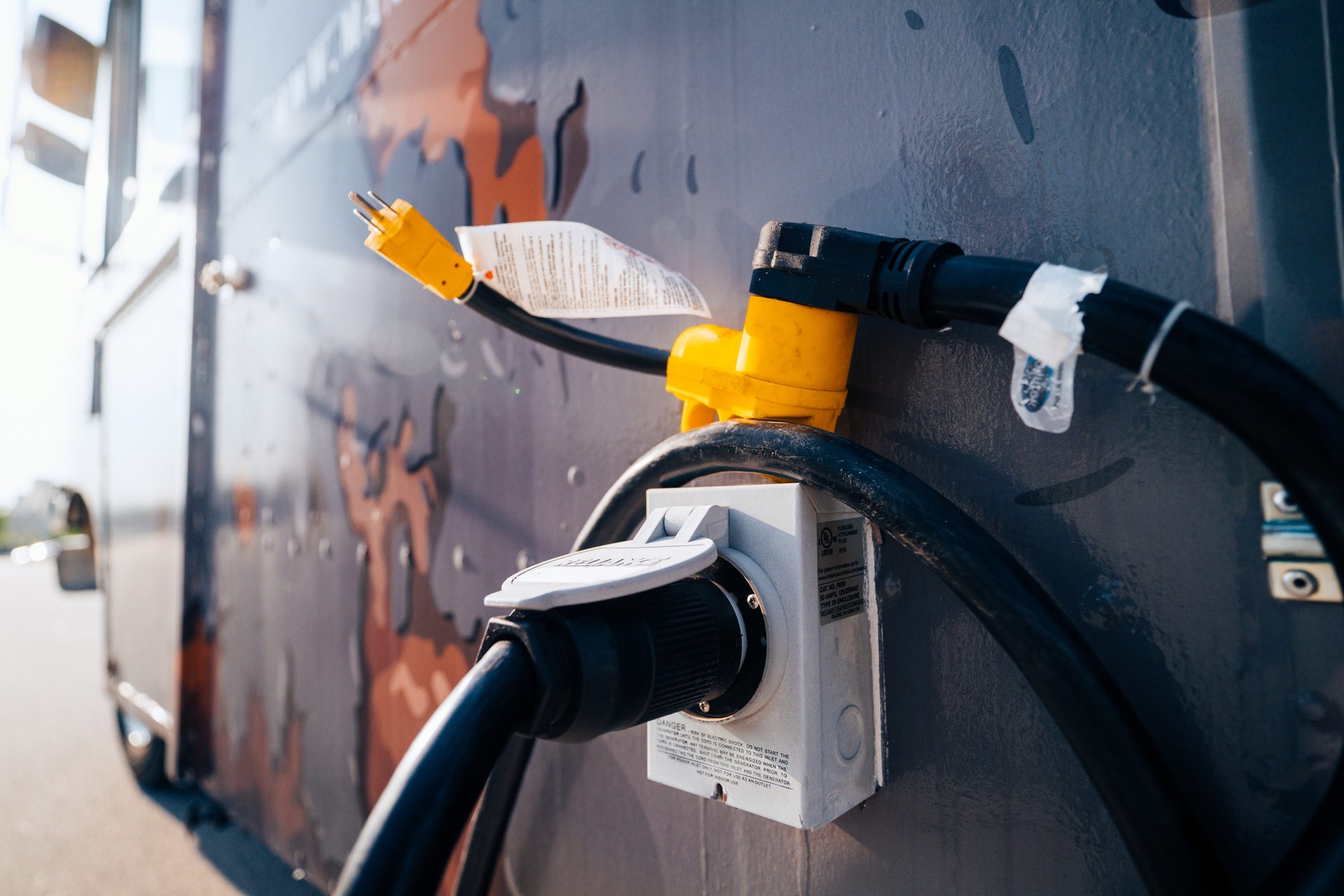 Electrical connections and power cords on the side