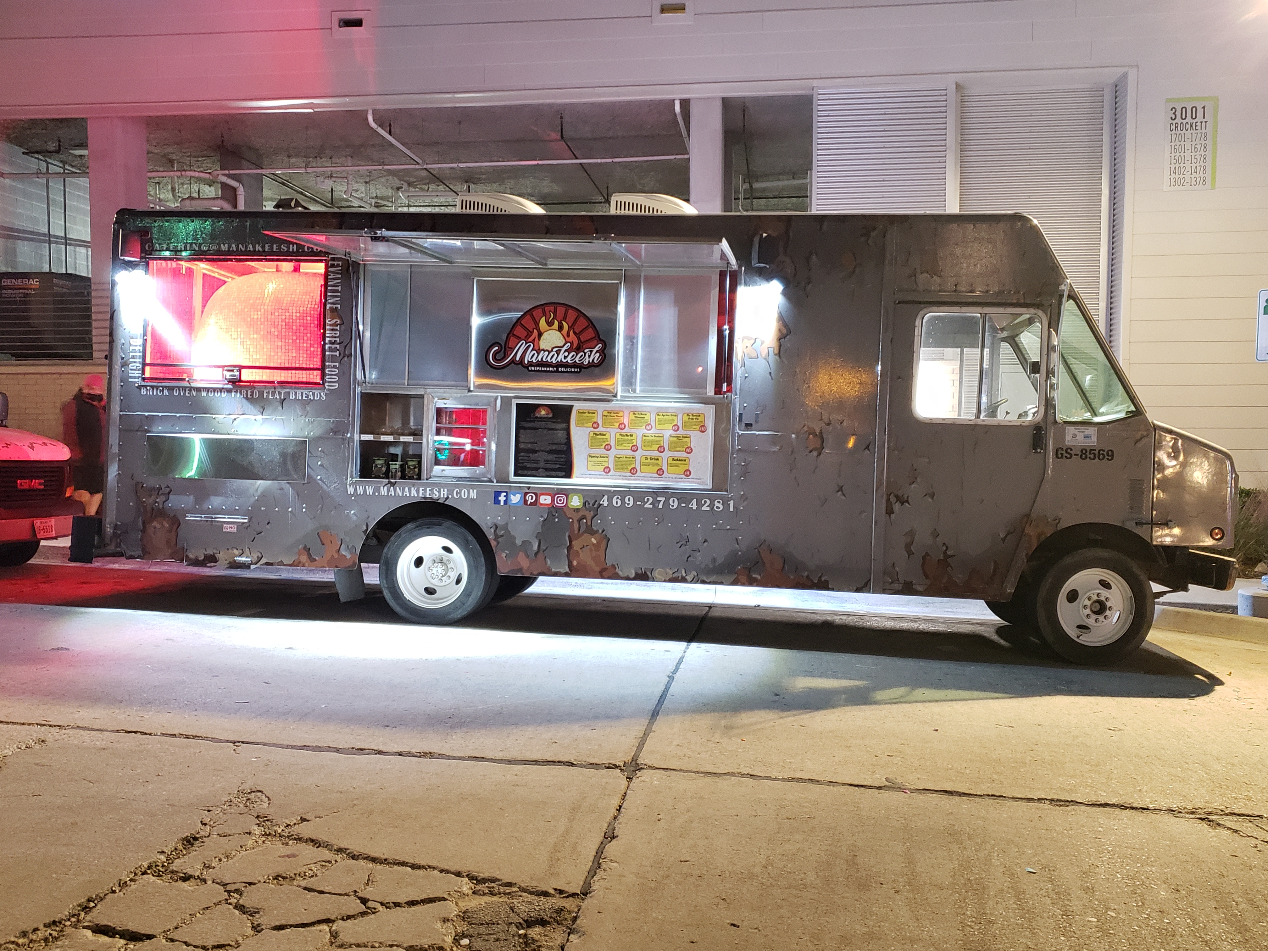 Manakeesh food truck lit up at night
